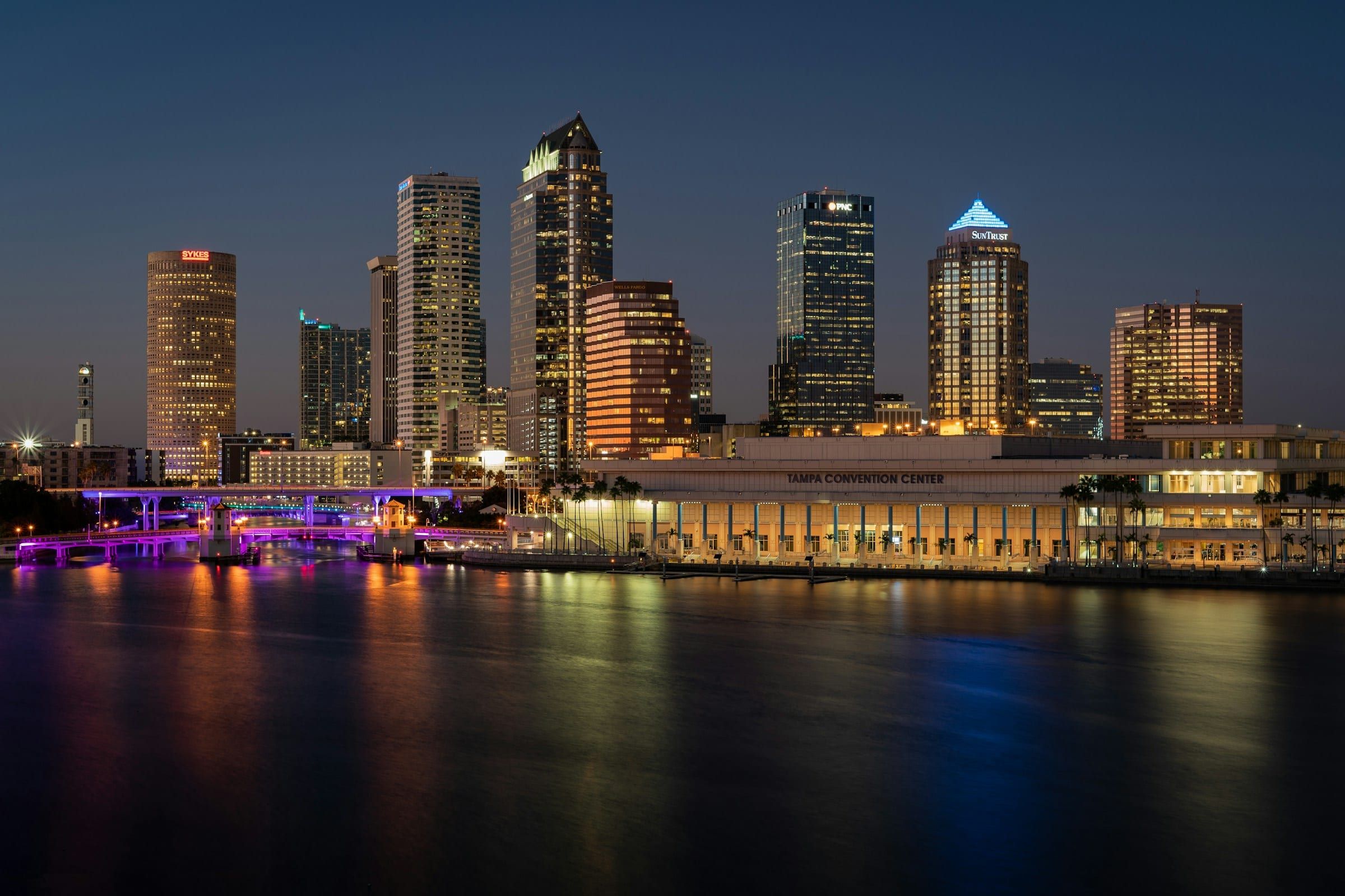 Downtown Tampa skyline lit at night across the water in Hillsborough County, Florida